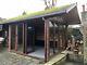 Timber summer house/ garden cabin with bifold doors and adjoining shed