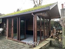 Timber summer house/ garden cabin with bifold doors and adjoining shed